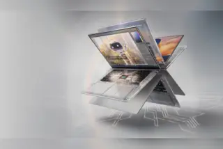 מחשב נייד שקוף ומתכתי עם שבב RTX Spark של אנבידיה, על רקע אפור עם קווי מעגלים זוהרים